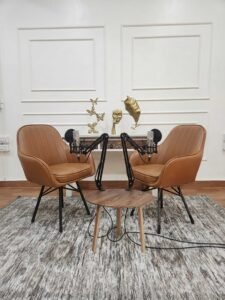 Podcast recording setup at Lens Grove Studio, a professional photo and video shoot rental space in Delhi, featuring two comfortable chairs, microphones on adjustable boom arms, a central table, and acoustic-friendly décor, designed for high-quality podcast and interview recordings.